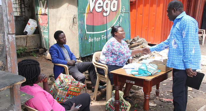 Rev. Dr Kwabena Opuni-Frimpong (left), the General Secretary of the Christian Council of Ghana, interacting with EC exhibition officials  Pictures: GLADYS ATTA BOATENG